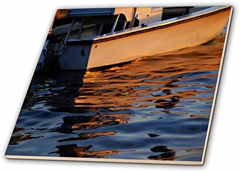 3תמונת רוז של השתקפויות בכתום וכחול של אריחי סירה קטנים